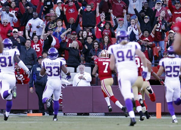 49ers quarterback Colin Kaepernick (7) ran away from Vikings defenders for 78 yard touchdown in the second quarter of a preseason game.
