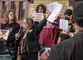 Stacey Gurian-Sherman of Minneapolis for a Better Police Contract spoke during a rally outside the Bureau of Mediation Services office Wednesday in St