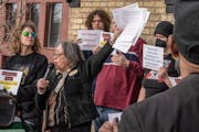 Stacey Gurian-Sherman of Minneapolis for a Better Police Contract spoke during a rally outside the Bureau of Mediation Services office Wednesday in St