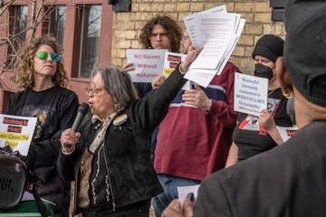 Stacey Gurian-Sherman of Minneapolis for a Better Police Contract spoke during a rally outside the Bureau of Mediation Services office Wednesday in St