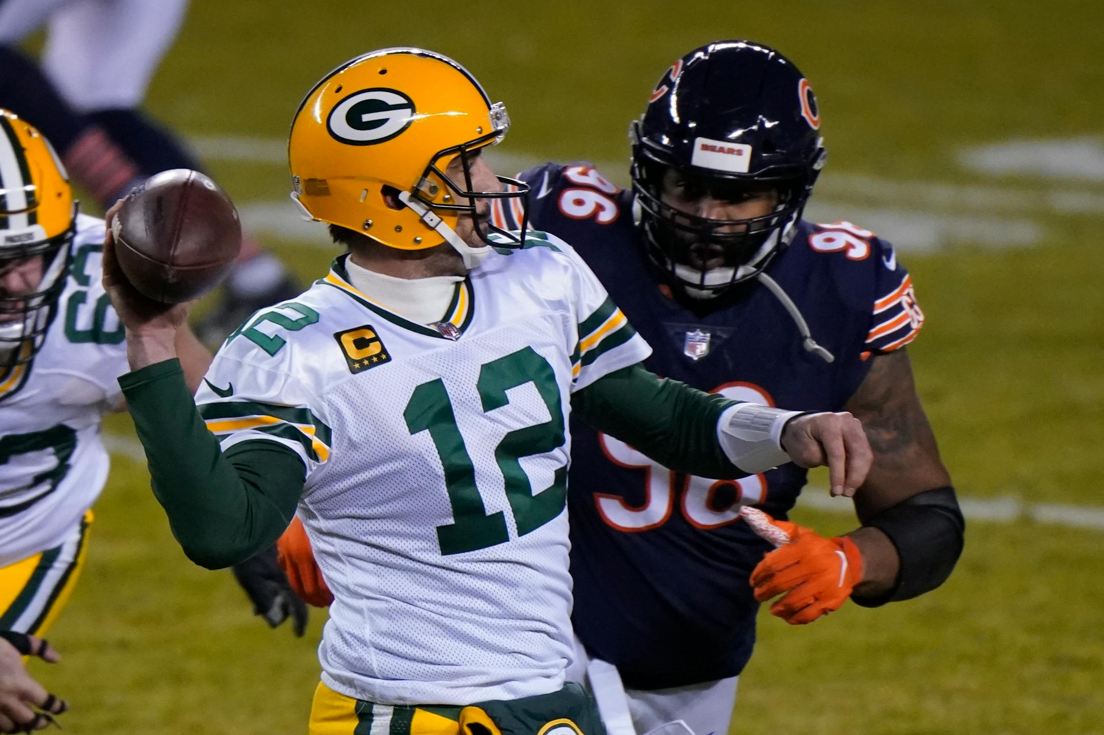 Green Bay Packers' Aaron Rodgers throws a pass during the second half of an NFL football game against the Chicago Bears Sunday, Jan. 3, 2021, in Chicago. (AP Photo/Nam Y. Huh)