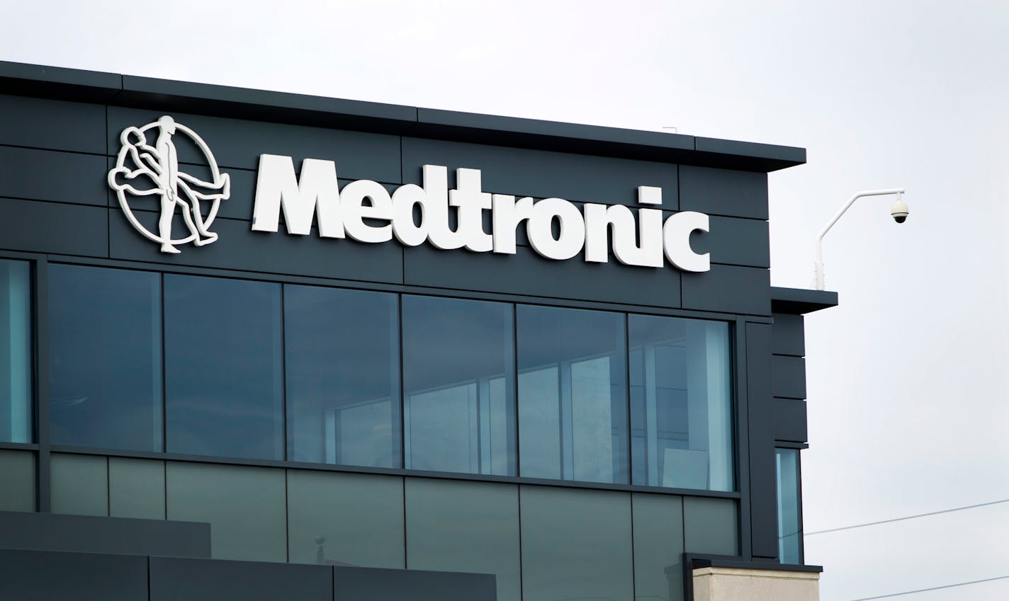 Medtronic Inc. signage is displayed at the company's office in Toronto, Ontario, Canada, on Wednesday, Aug. 31, 2011. Metronic Inc, the world's largest medical technology company, develops therapeutic and diagnostic medical products. Photographer: Brent Lewin/Bloomberg