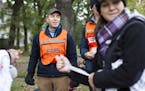 Dr. Jamie Peters coordinates a crew of professionals as they volunteer at a medical station on East River Parkway in Minneapolis during the Twin Citie