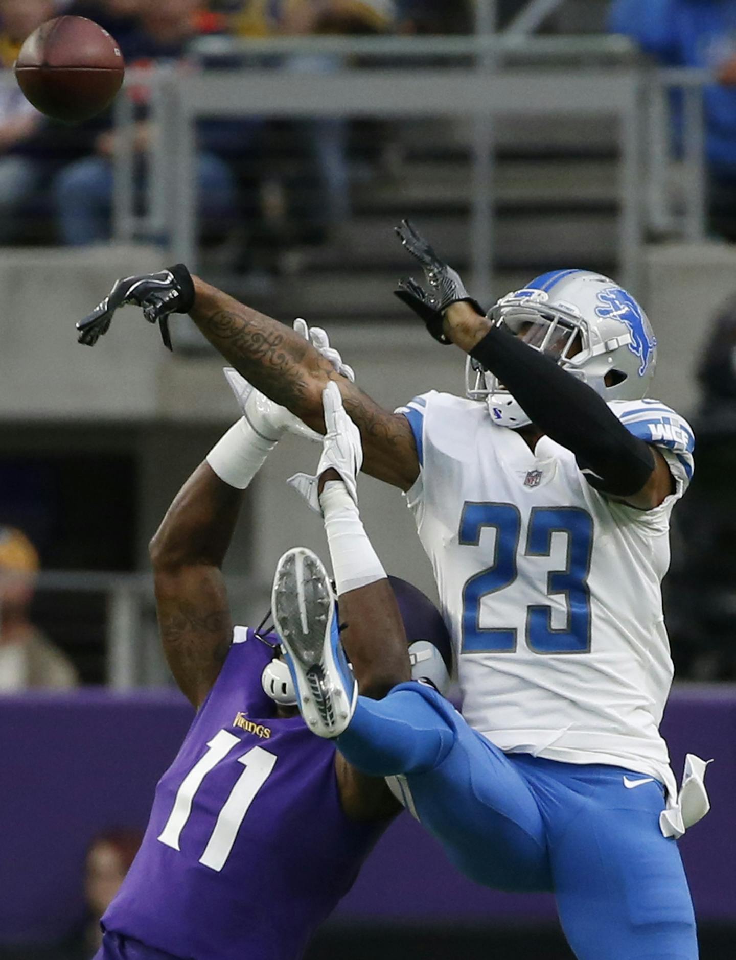 Detroit Lions cornerback Darius Slay, right, breaks up a pass intended for Minnesota Vikings wide receiver Laquon Treadwell (11) during the second half of an NFL football game, Sunday, Oct. 1, 2017, in Minneapolis. (AP Photo/Bruce Kluckhohn)