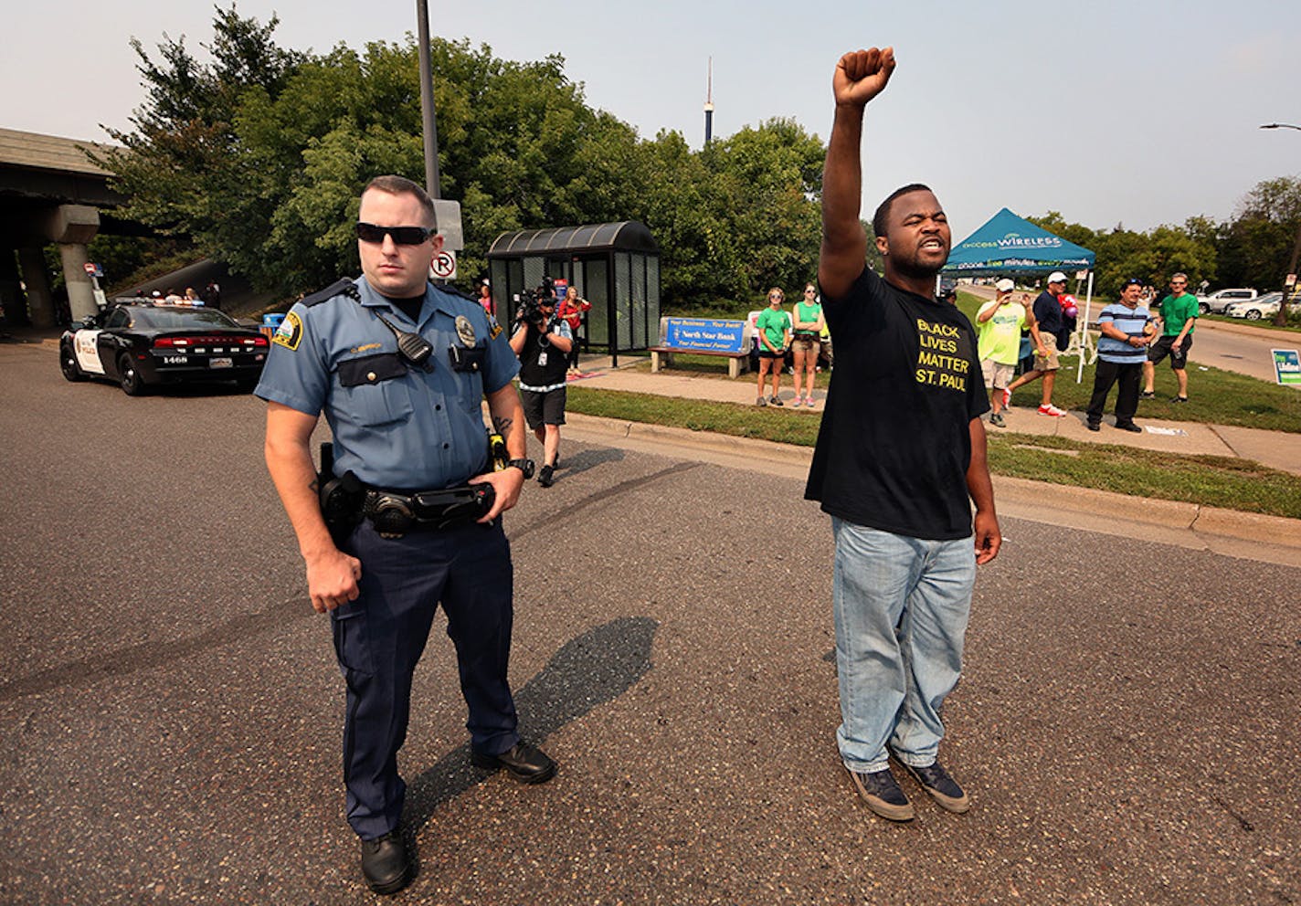 Rashad Turner, lead organizer for Black Lives Matter St. Paul, lead the group down Como Ave.