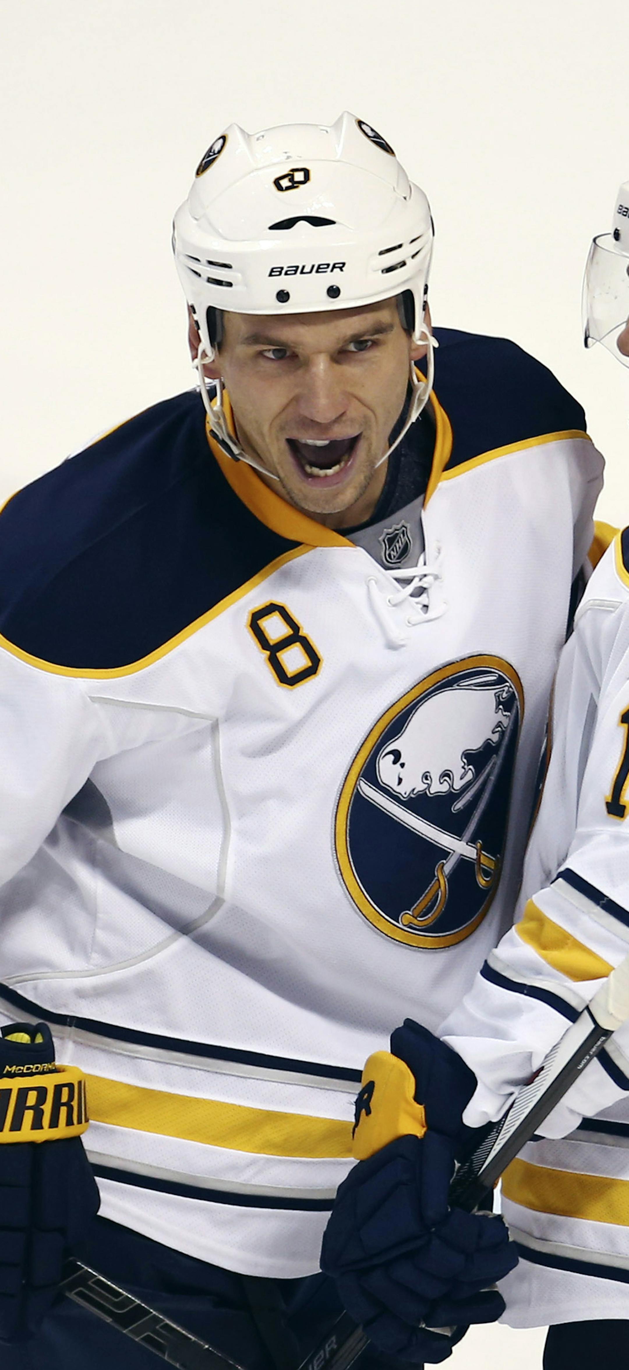 Buffalo Sabres' Cody McCormick (8) celebrates with Cody Hodgson after Hodgson scored a goal during the third period of an NHL hockey game in Sunrise, Fla., against the Florida Panthers, Friday, Oct. 25, 2013. The Sabres won 3-1. (AP Photo/J Pat Carter) ORG XMIT: FLJC113