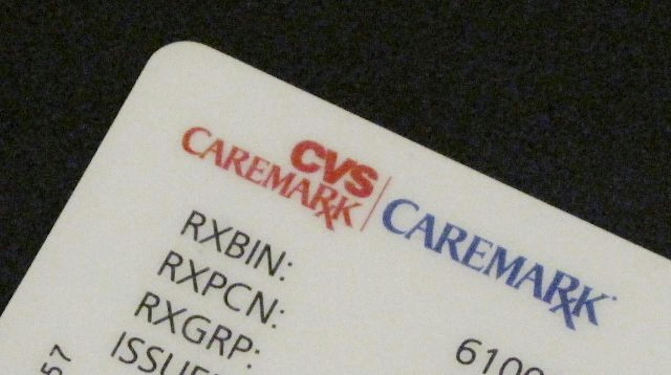 In this photo illustration a CVS Caremark user card is shown Monday, May 1, 2009. CVS Caremark said Tuesday, first-quarter profit fell slightly on charges and higher costs, outweighing a 12 percent jump in the drugstore operator's revenue from higher pharmacy sales.
