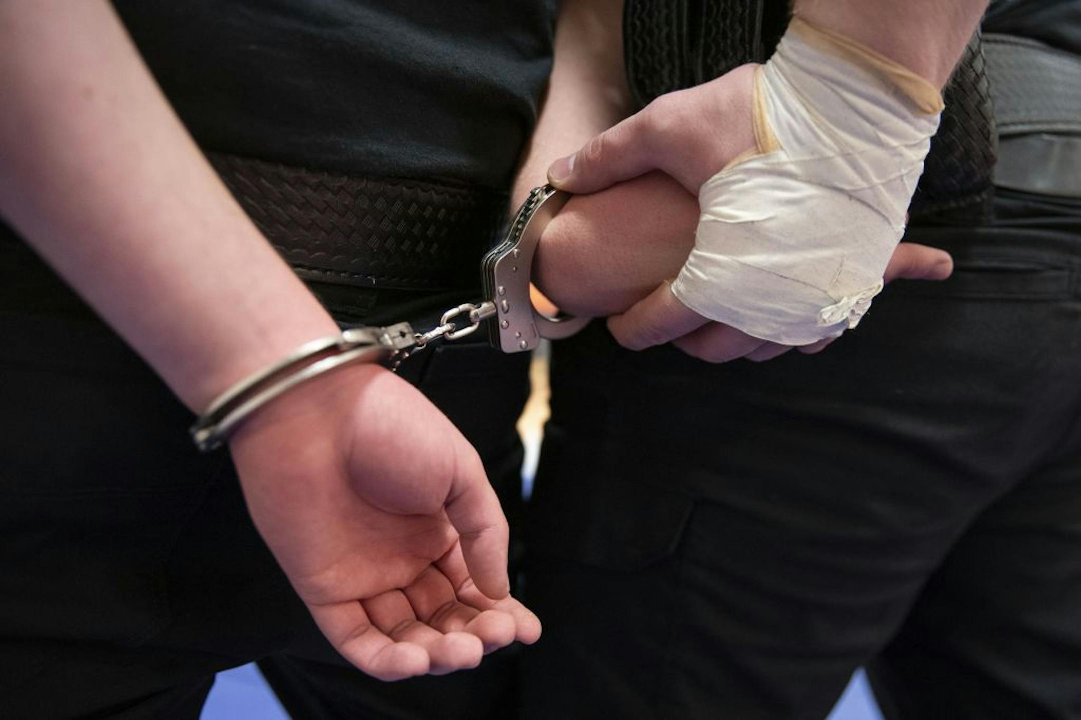 Law Enforcement trainees practiced handcuffing techniques during defensive tactics class in the gymnasium at Fond Du Lac Tribal and Community College in Cloquet, Minn. on Tuesday November 17, 2020.