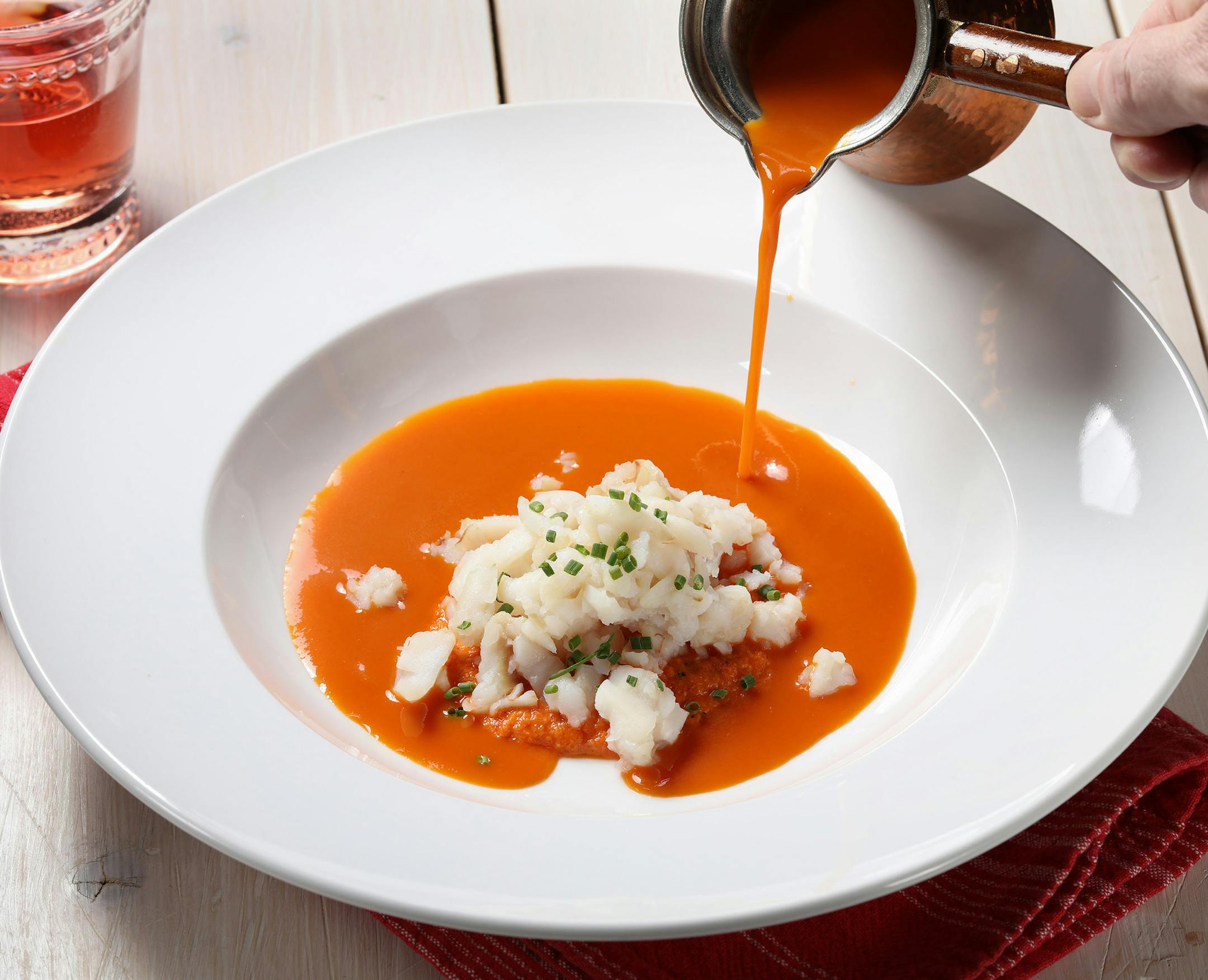 The Niçoise-style soup has a base of sautéed vegetables and tomatoes.