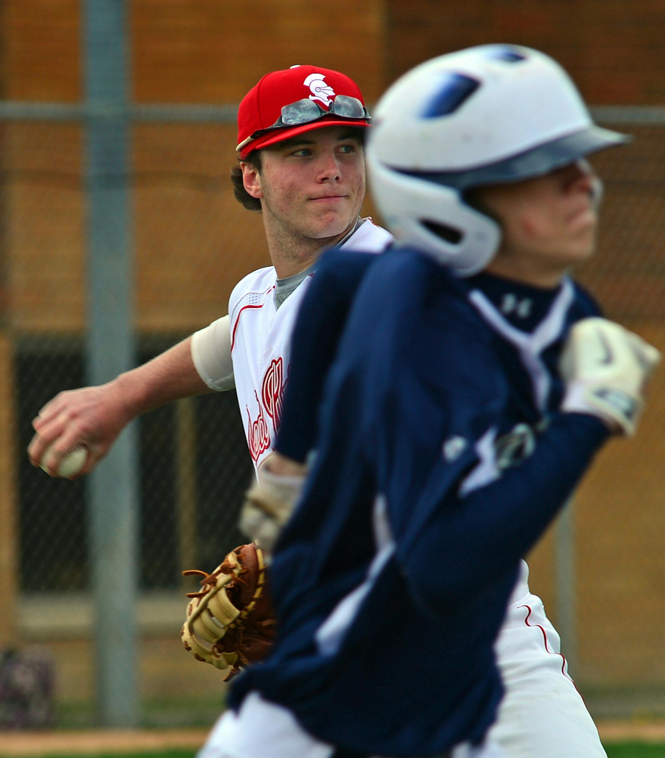 Benilde-St. Margaret's Jimmy Cron, number 15 throws to 1st base in the second inning of a game with Robinsdale High. ]Benilde-St. Margaret's is having its best baseball season under coach Greg Hoemke, who won his 100th career game this year. Richard.Sennott@startribune.com Richard Sennott/Star Tribune St Louis Park Minn. Friday 5/16/2014) ** (cq)