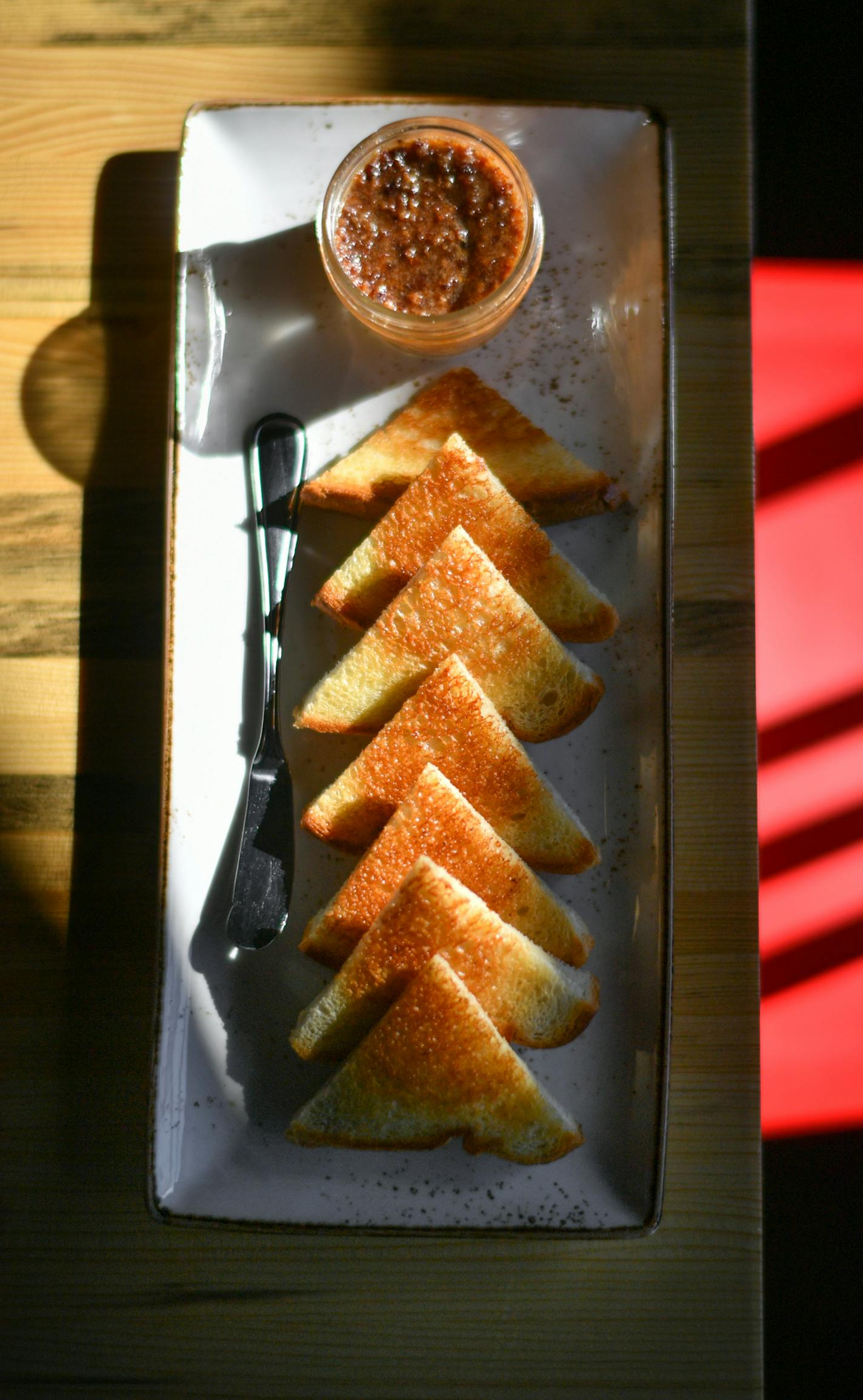 Hugh's Pimento Cheese, bacon marmalade and pullman toast. ] GLEN STUBBE &#x2022; glen.stubbe@startribune.com Friday February 17, 2017 Punch Bowl Social, a new Denver-based eatertainery chain, has landed at the Shops at West End in St. Louis park, with a Southern diner-inspired menu. Restaurant review. Please arrive before the lunch rush and shoot food: Pimiento cheese, black eyed pea hummus, knockoff burger, bologna sandwich, chicken and waffles, chips and dip. From bar: shrub and punch.