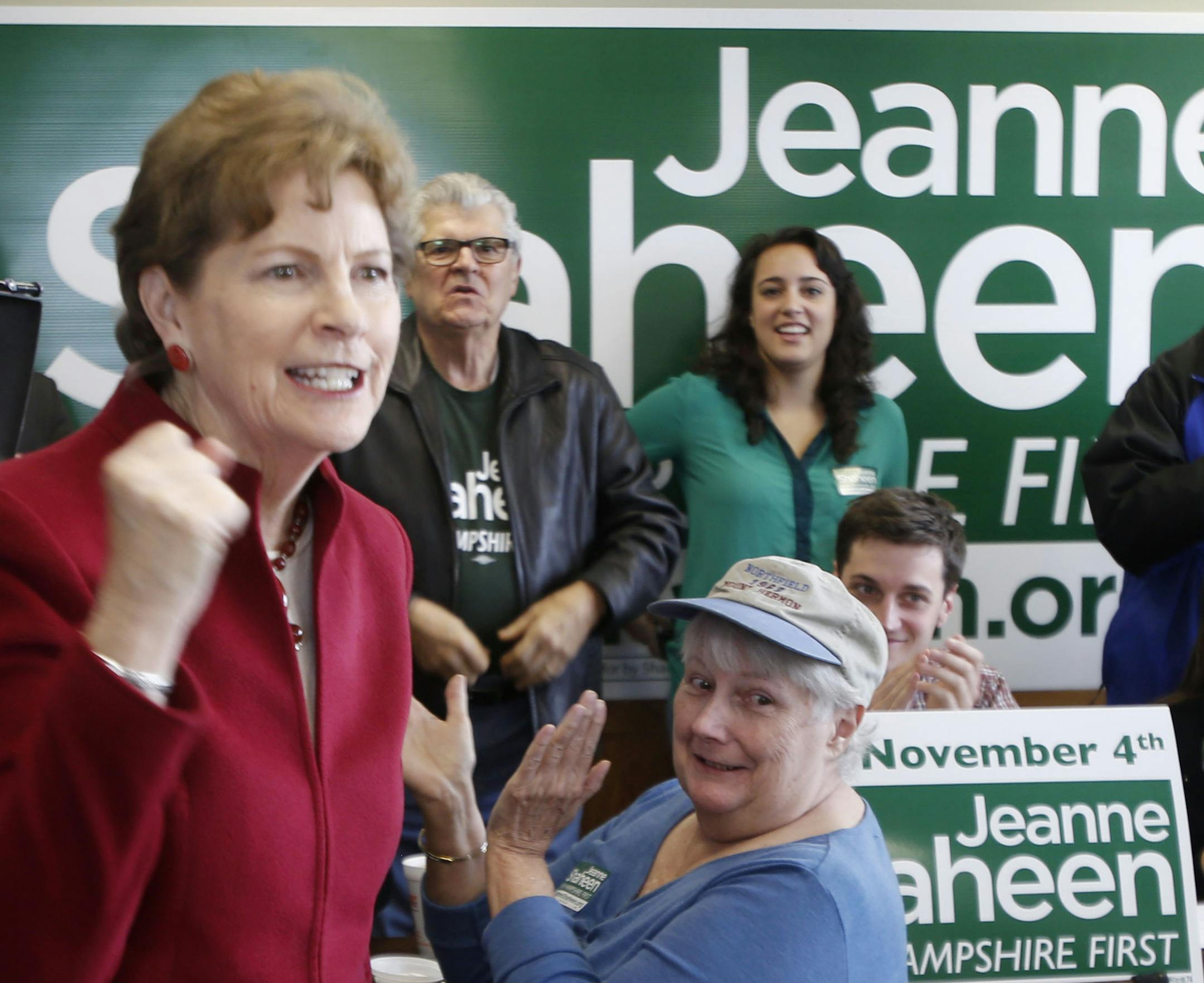 Incumbent U.S. Sen. Jeanne Shaheen, D-N.H., works to rally volunteers Friday Oct. 31, 2014 at her Manchester, N.H. campaign headquarters before next weeks general election. Republican Scott Brown is trying to unseat Shaheen. (AP Photo/Jim Cole) ORG XMIT: MIN2014110115301421