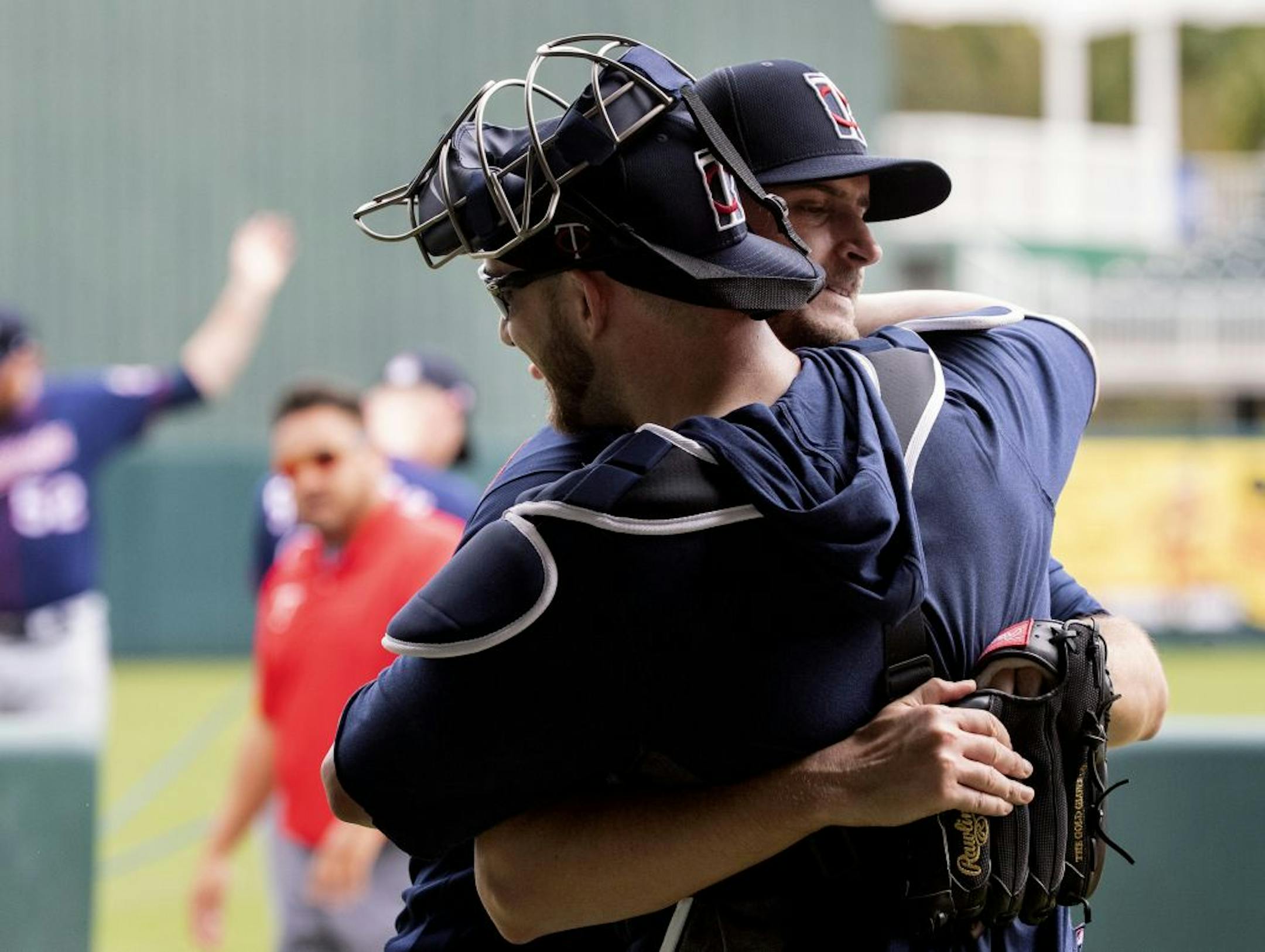 Minnesota Twins pitcher Jake Odorizzi hugged catcher Mitch Garver after throwing in the bullpen.
