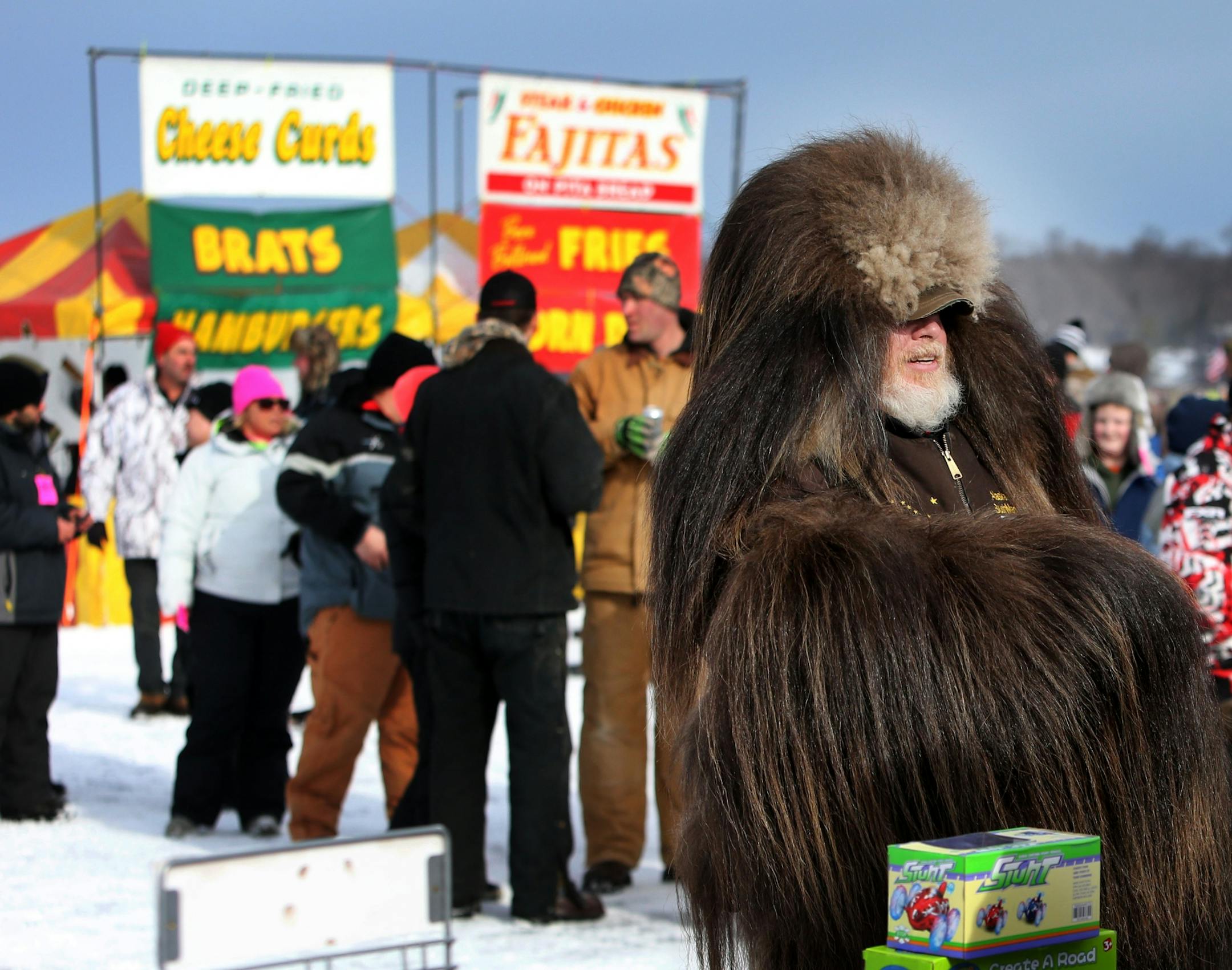 Mark Braaten of South Dakota was on hand as the Alaska Bush Man as part of Alaska's Healing Heart which raises money to take wounded veterans hunting. Braaten was among the 10,000 people on Hole in the Day Bay of Gull Lake for the Ice Fishing Extravaganza Saturday, Feb. 6, 2016, in Brainerd, MN.