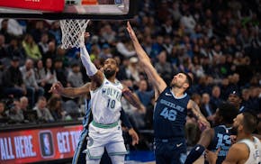 Timberwolves guard Mike Conley put up a shot early in the first quarter against the Grizzlies. It was his buckets late in the game, however, that spar