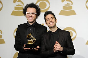 Ian Axel, left, and Chad King, of A Great Big World pose in the press room with the award for best pop duo/group performance for "Say Something" at th