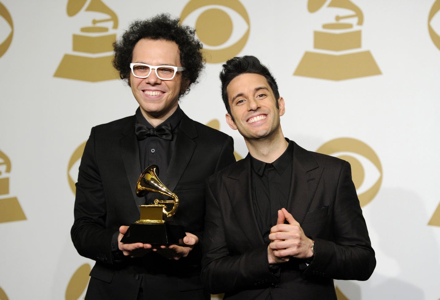 Ian Axel, left, and Chad King, of A Great Big World pose in the press room with the award for best pop duo/group performance for "Say Something" at the 57th annual Grammy Awards at the Staples Center on Sunday, Feb. 8, 2015, in Los Angeles.