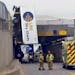Two people were injured when an airport catering truck went headfirst over a barricade on its way to deliver food to an airplane at Minneapolis-St. Pa