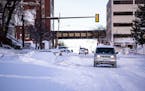 A Jeep made its way down a snow-covered road in Duluth in December.