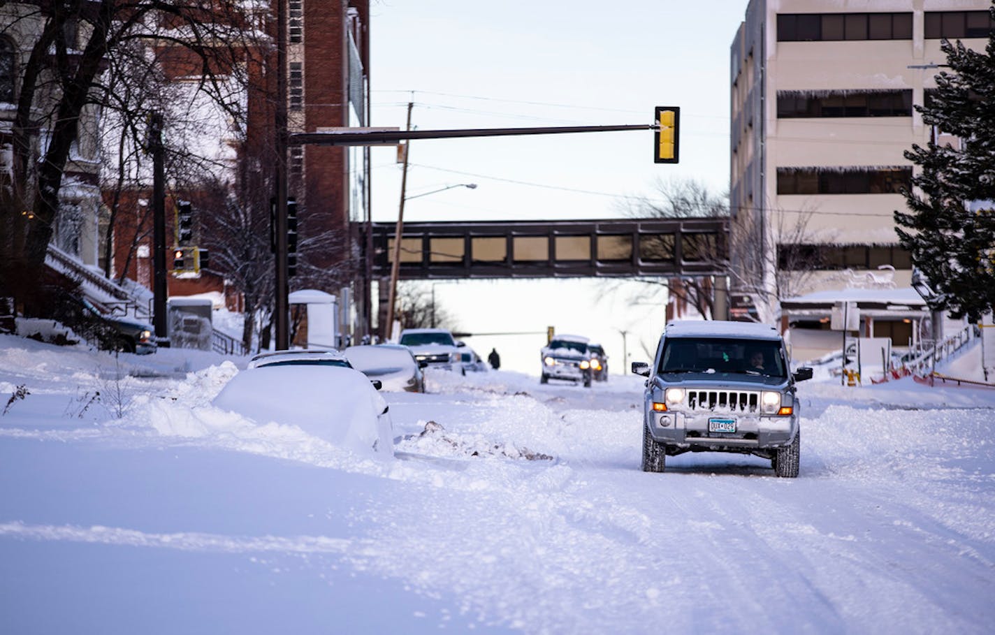 A Jeep made its way down a snow-covered road in Duluth in December.