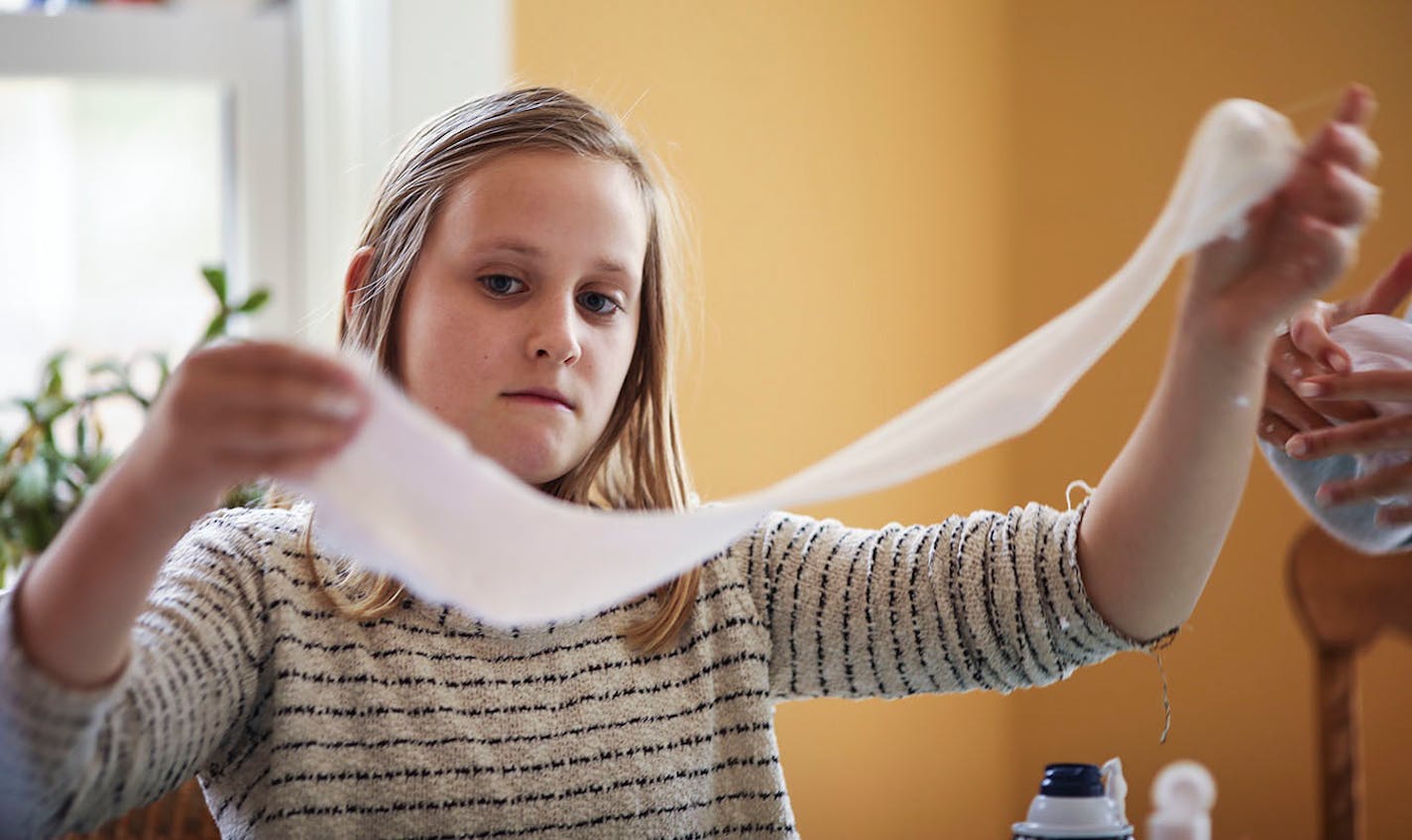 Annabell Soresnsen checked the elasticity of her batch of slime.