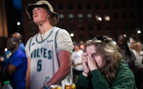 Fans including Sam Haider and Lauren Taylor watched the game unfold at the Wolves Back Block Party near Target Center Thursday night.