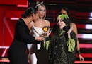 Alicia Keys, from left, and Dua Lipa present Billie Eilish with the award for best new artist at the 62nd annual Grammy Awards on Sunday, Jan. 26, 202