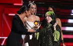 Alicia Keys, from left, and Dua Lipa present Billie Eilish with the award for best new artist at the 62nd annual Grammy Awards on Sunday, Jan. 26, 202