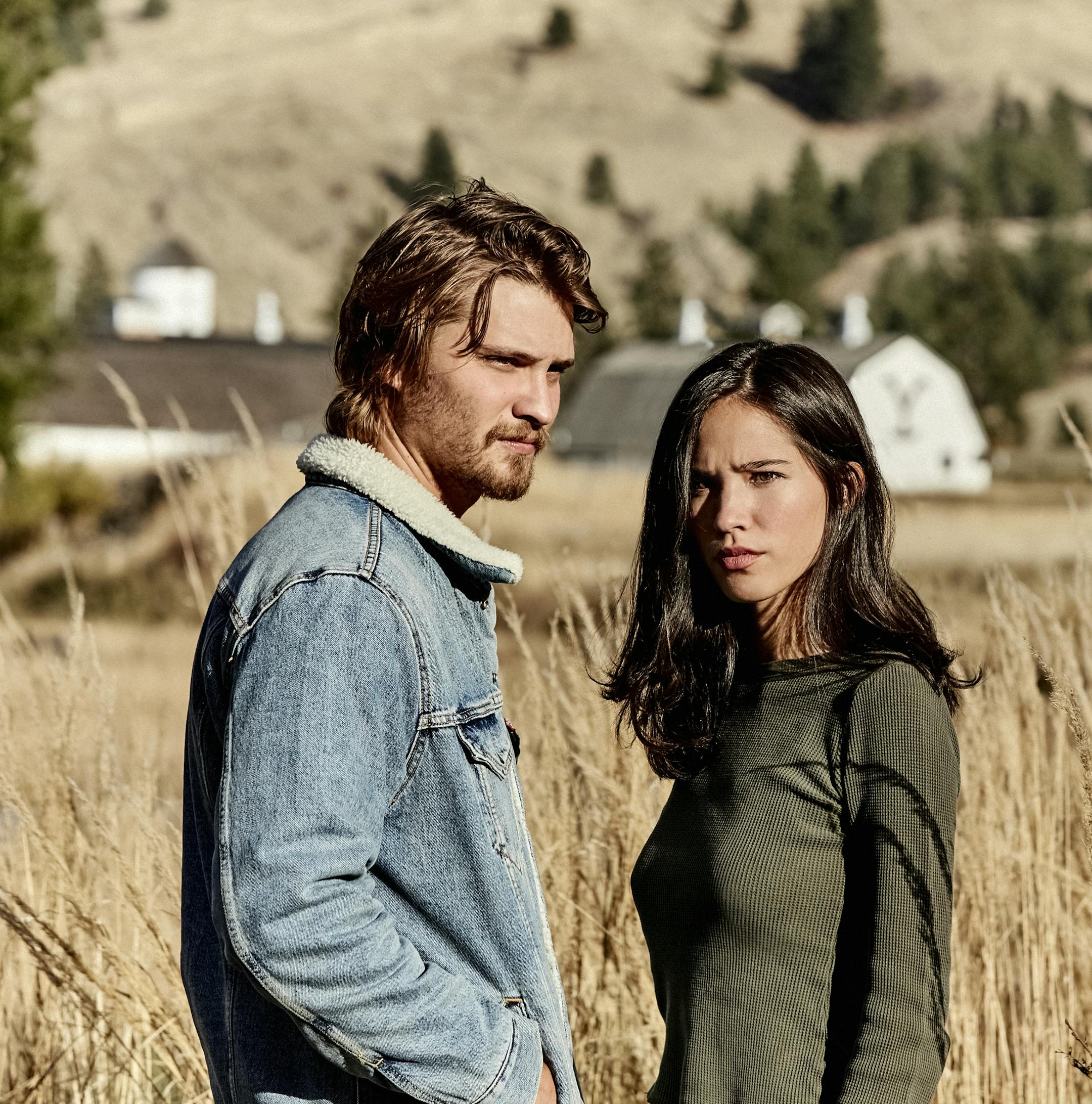 This image released by Paramount Network shows Luke Grimes, left, and Kelsey Asbille from the series "Yellowstone" premiering Wednesday, June 20. (Kevin Lynch/Paramount Network via AP)