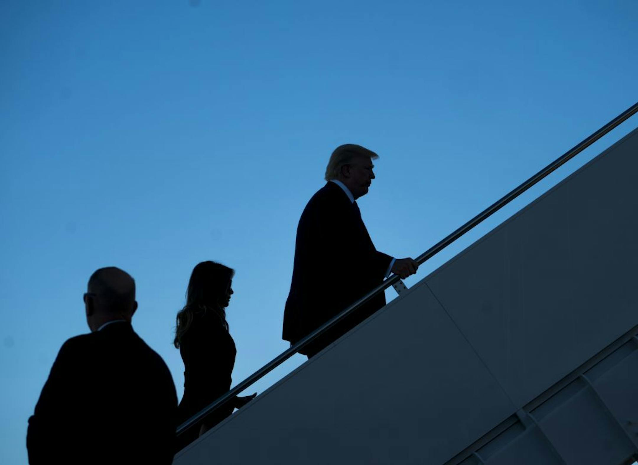 President Donald Trump and first lady Melania Trump board Air Force One on Wednesday for a trip to Las Vegas, at Andrews Air Force Base in Maryland.