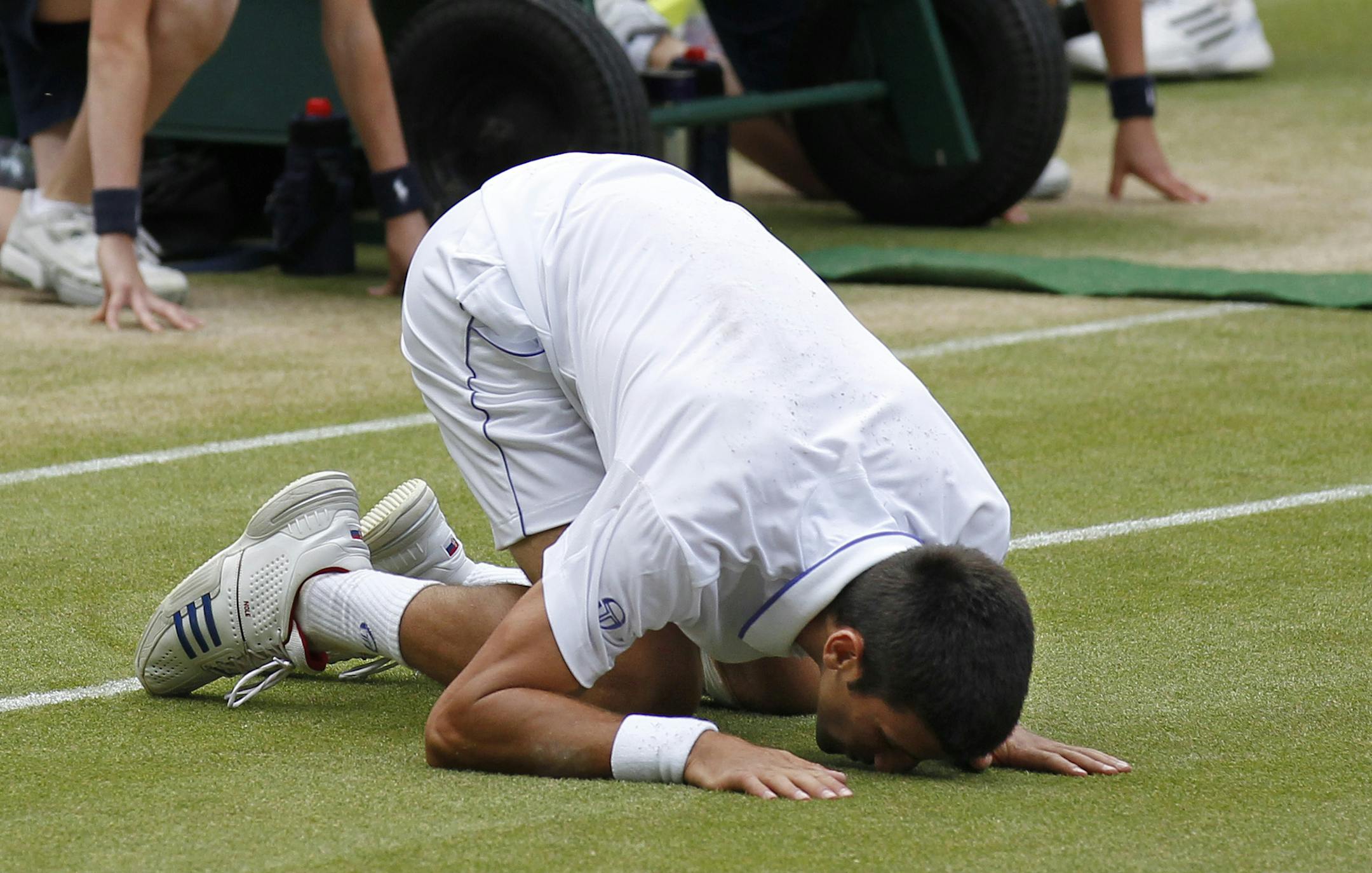 In 2011, Serbia’s Novak Djokovic kissed the court as he celebrated after defeating France’s Jo-Wilfried Tsonga in their men’s semifinal at the All England Lawn Tennis Championships.
