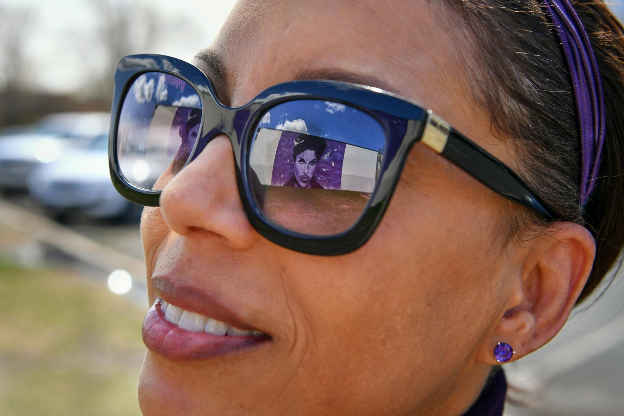 Eva Morse looked at the Prince mural on the side of the Chanhassen Cinema. She travelled from Los Angeles to lay flowers down for Prince. She said she has seen him perform 18 or 19 times and has loved him since she was 11 years old.