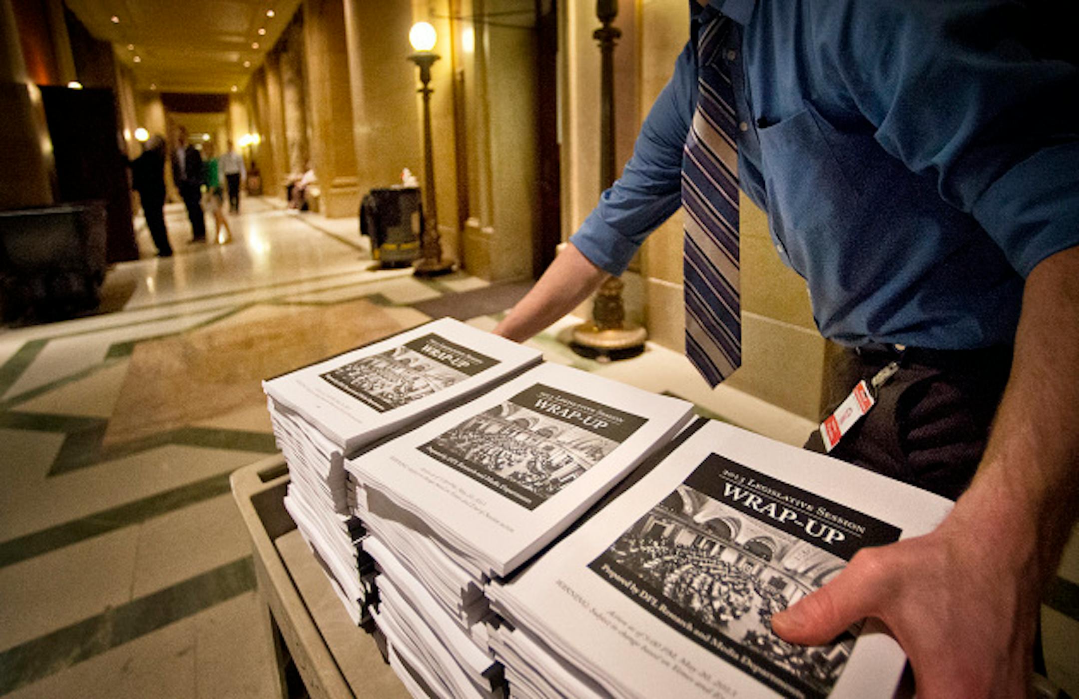 In the final hour of the session, printed copies of the Legislative Wrap-up were delivered to the House. Monday, May 20, 2013  ]   GLEN STUBBE * gstubbe@startribune.com