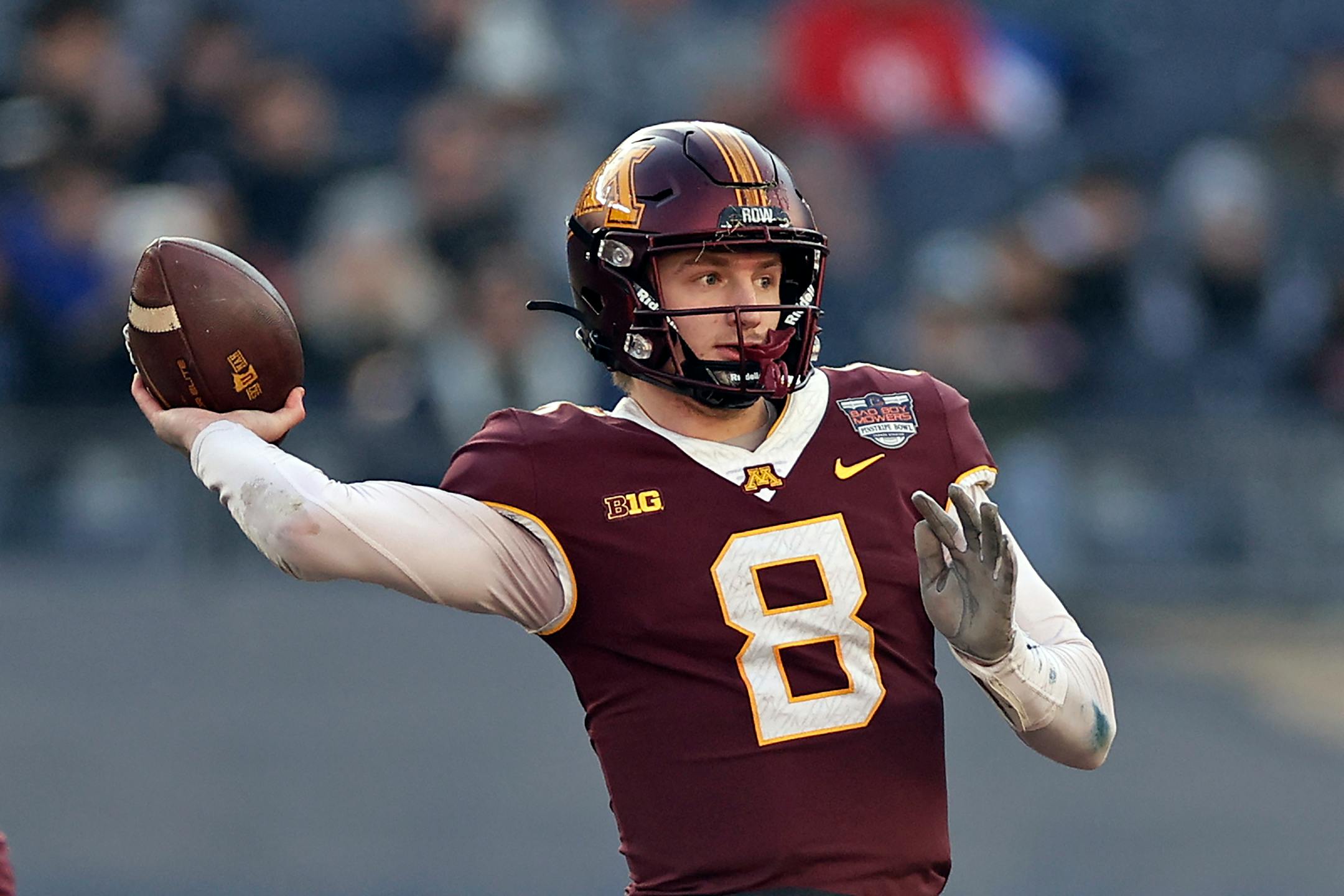 Minnesota quarterback Athan Kaliakmanis (8) throws against Syracuse during the first half.