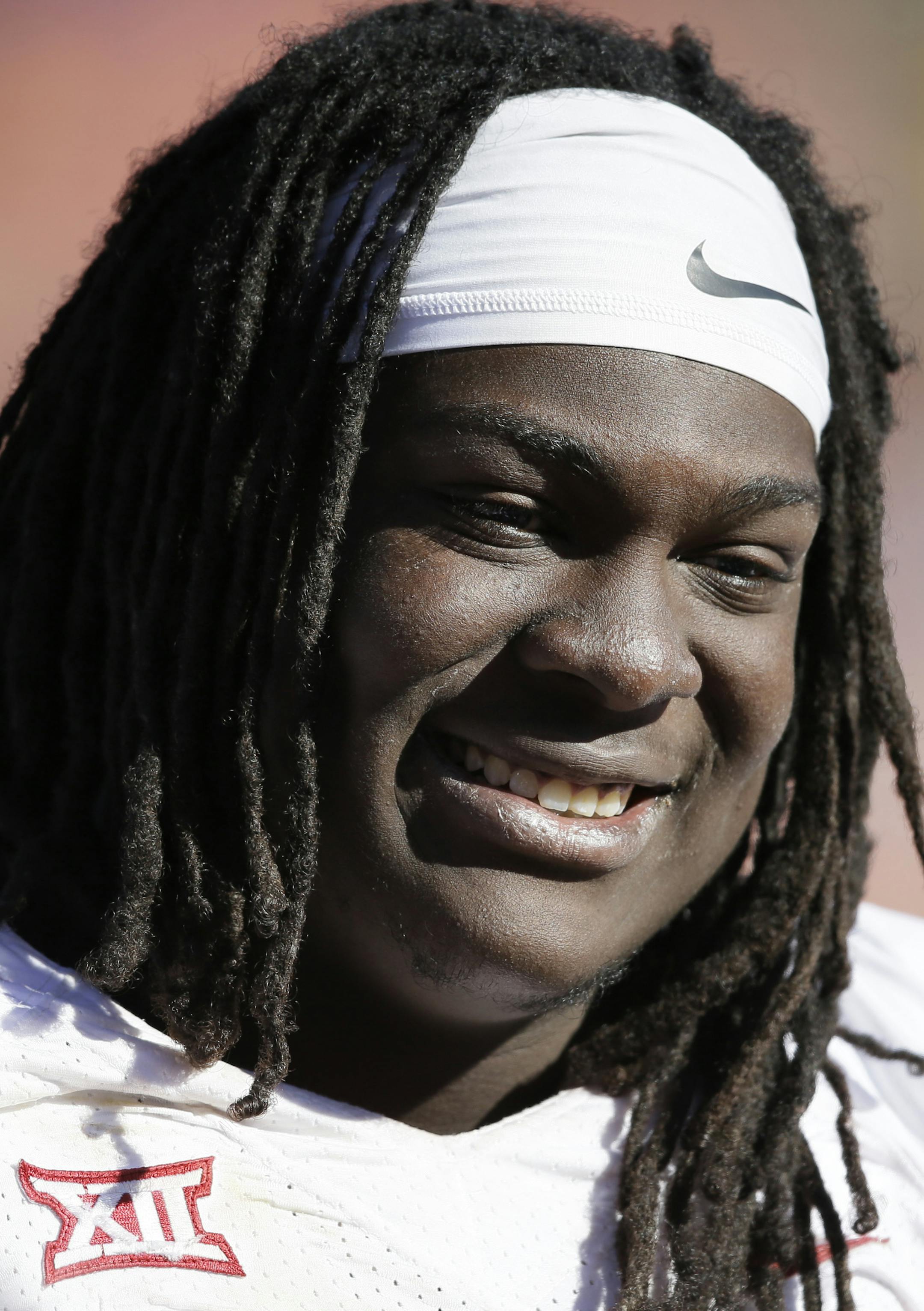 Oklahoma offensive tackle Tyrus Thompson stands on the sidelines during the second half of an NCAA college football game against Iowa State, Saturday, Nov. 1, 2014, in Ames, Iowa. Oklahoma won 59-14. (AP Photo/Charlie Neibergall) ORG XMIT: IACN1