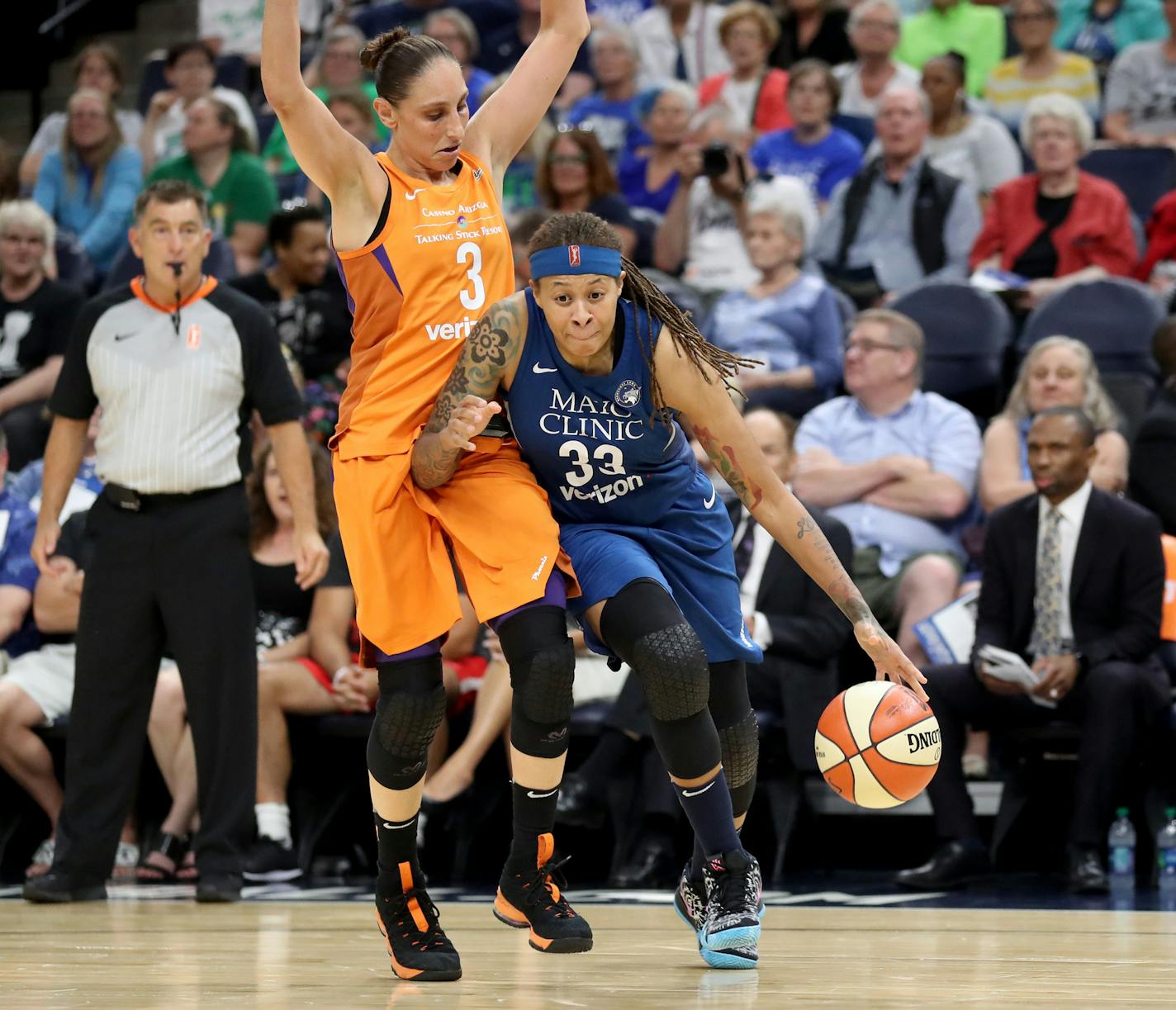 The Minnesota Lynx's Seimone Augustus (33) dribbles by the Phoenix Mercury's Diana Taurasi (3) during the first quarter at the Target Center in Minneapolis on Friday, June 1, 2018. (David Joles/Minneapolis Star Tribune/TNS)