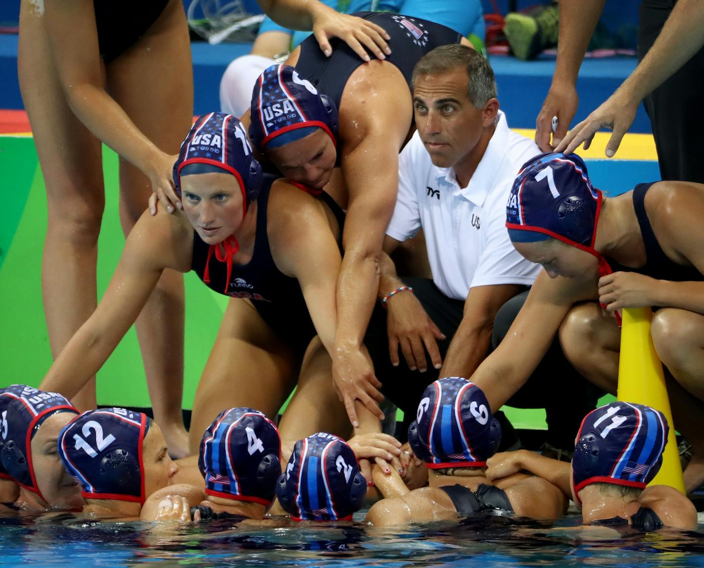 The U.S. women's water polo team secured a semifinal berth with a 13-3 victory over Brazil Monday afternoon at the Olympic Aquatics Stadium. Here, Coach Adam Kerkorian worked with his team during a time out. ] 2016 Summer Olympic Games - Rio Brazil brian.peterson@startribune.com Rio de Janeiro, Brazil - 08/15/2016 ORG XMIT: MIN1608151704141305