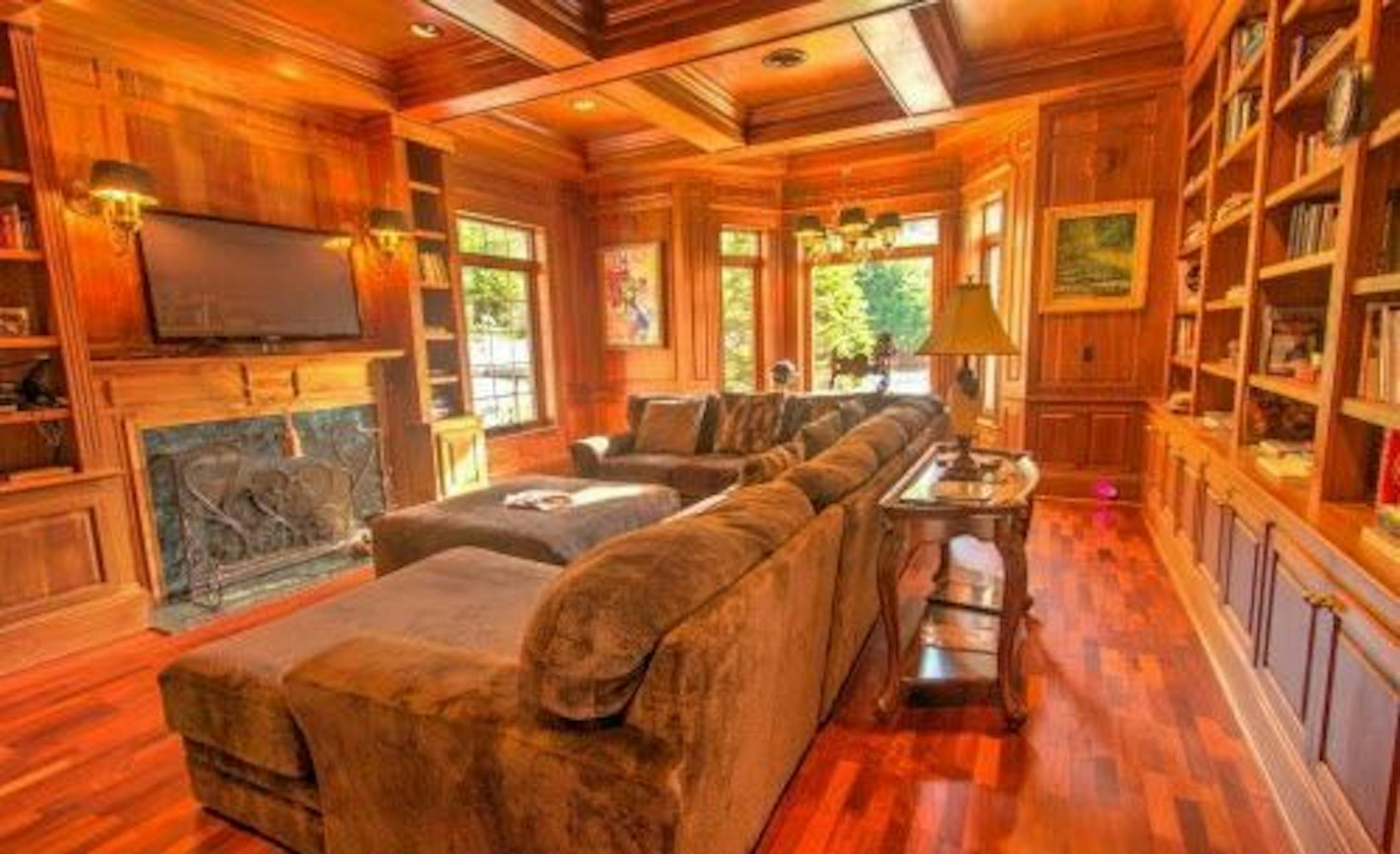 The wood-paneled library.