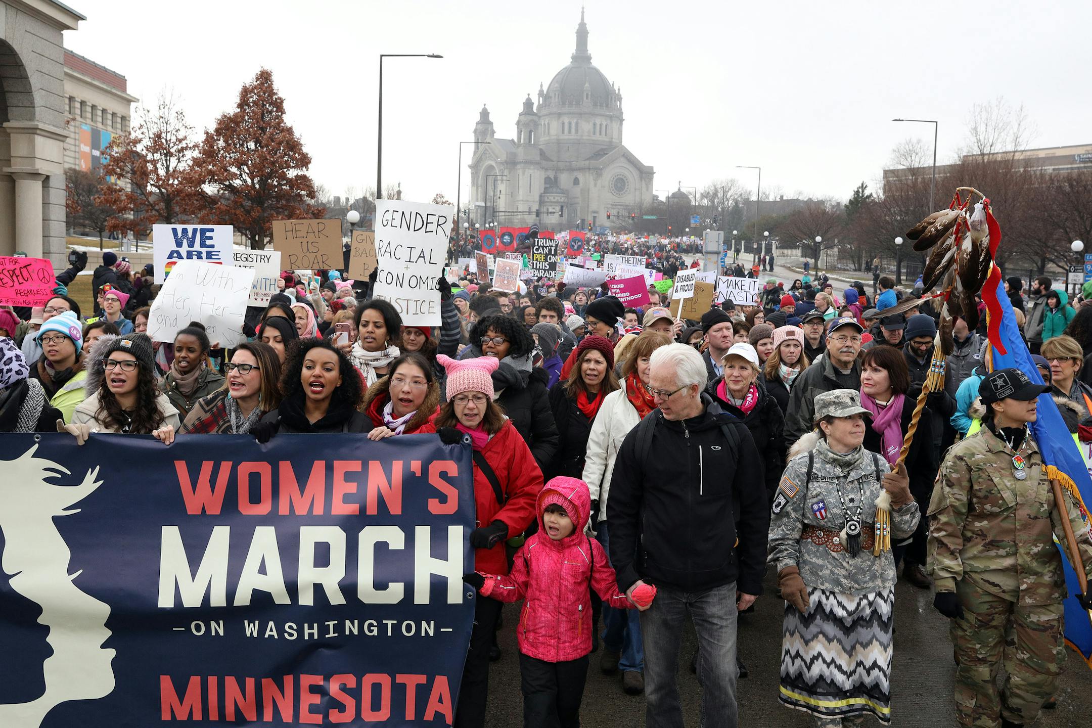 A young girl stood front and center at the Women's March during the Jan. 21 procession from St. Paul College to the State Capitol.