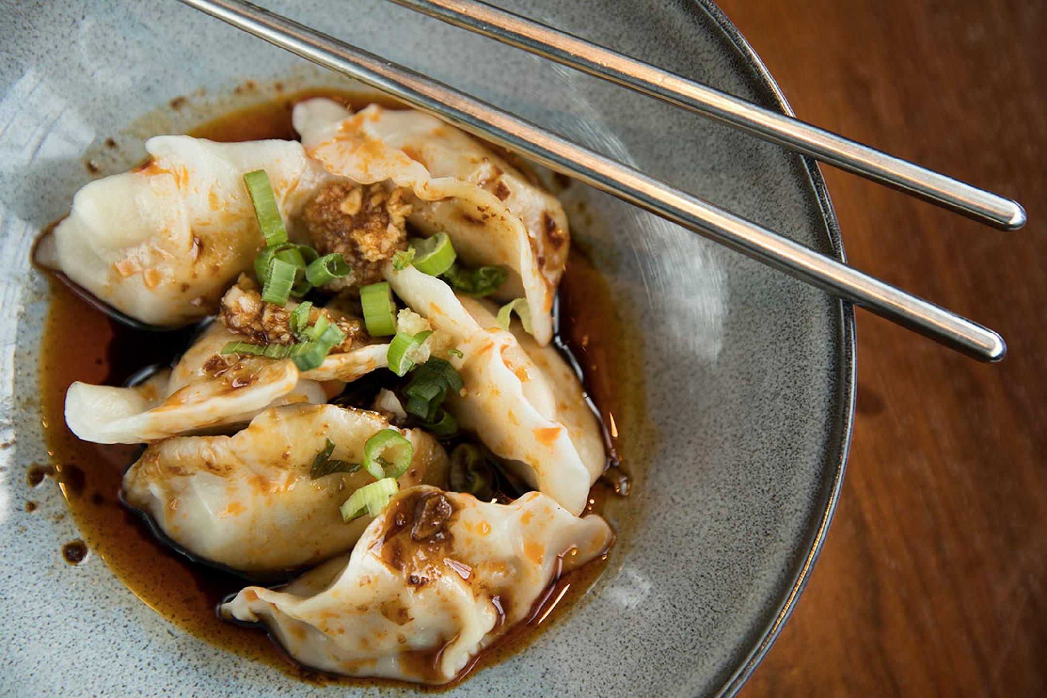 Sichuan dumplings with chili sauce.