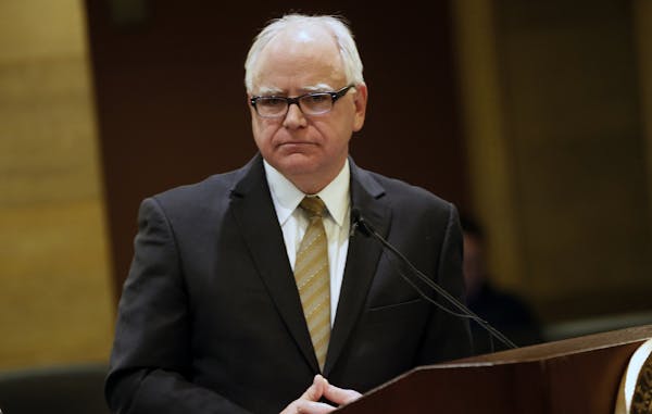 Gov. Tim Walz appears at a news conference in St. Paul in December.