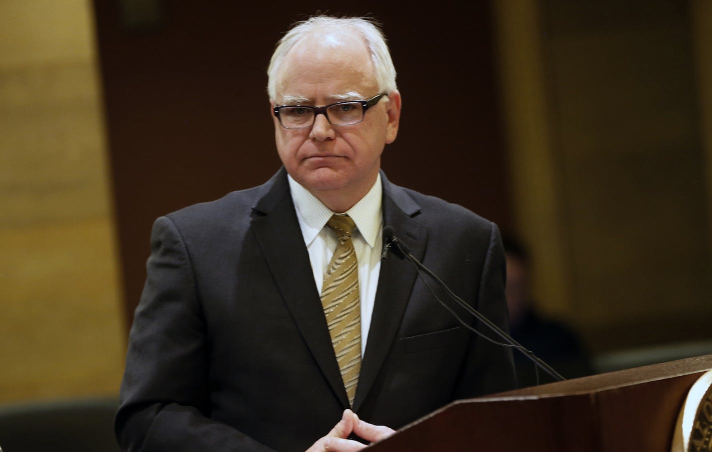 Gov. Tim Walz appears at a news conference in St. Paul in December.