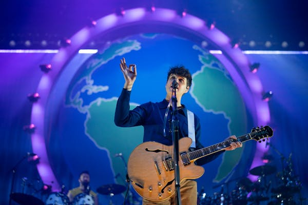 Ezra Koenig sang in front of a spinning globe and an expanded Vampire Weekend lineup Sunday at the Armory in Minneapolis.