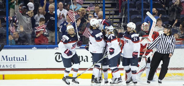 United States players celebrate a goal during the third period of the Four Nations Cup championship hockey game against Canada in Tampa, Fla., Sunday,