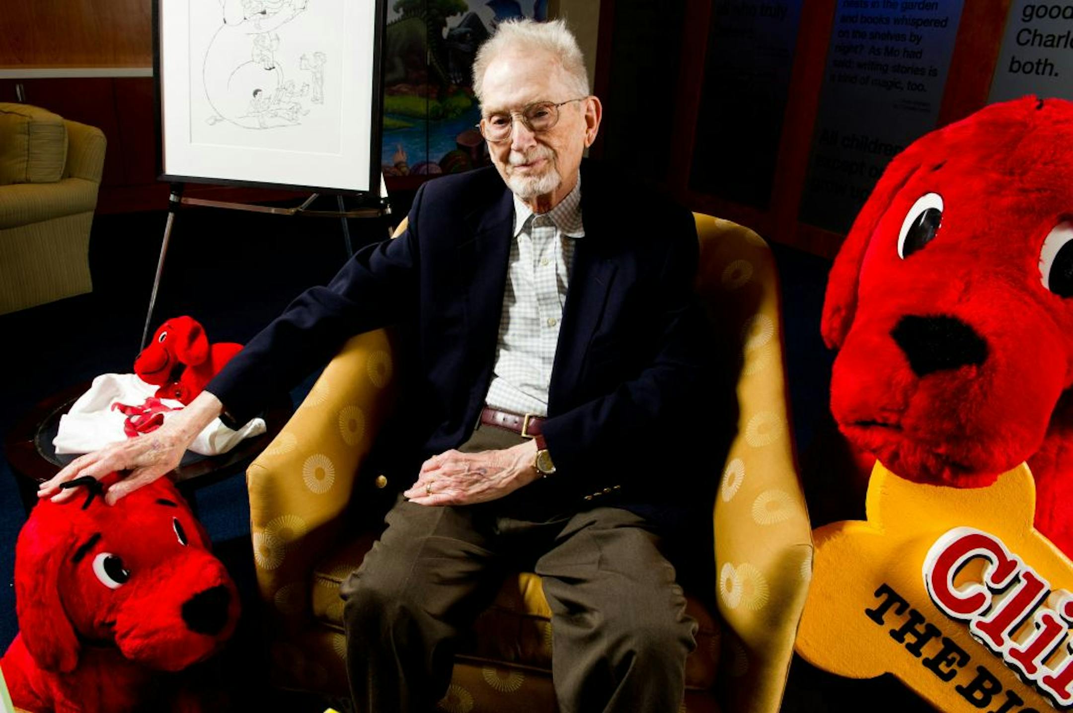 FILE - In this May 4, 2011 file photo, author and cartoonist Norman Bridwell poses for a portrait at Scholastic headquarters in New York. Bridwell, creator of the popular "Clifford the Big Red Dog" series of children's books turned into a PBS TV show, died Friday, Dec. 12, 2014, on Martha's Vineyard in Massachusetts. He was 86.