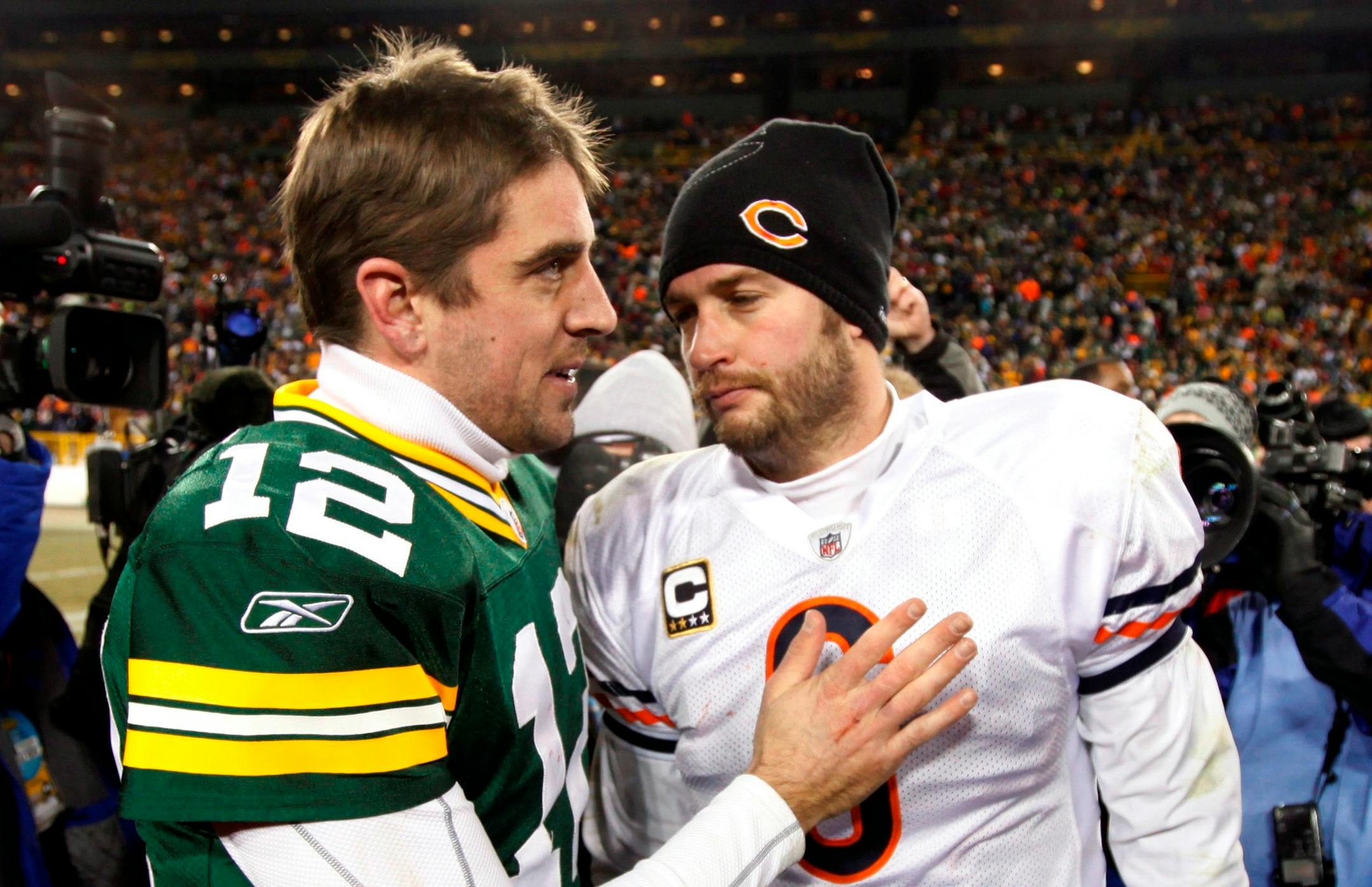 Green Bay Packers' Aaron Rodgers talks to Chicago Bears' Jay Cutler (6) after an NFL football game Sunday, Jan. 2, 2011, in Green Bay, Wis. The Packers won 10-3. (AP Photo/Mike Roemer)