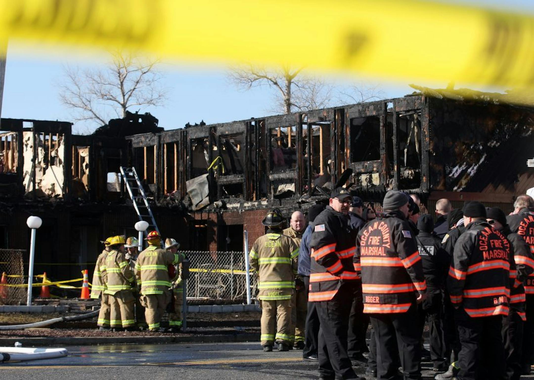 Firefighters investigate an early morning fire at the Mariner's Cove Hotel in Point Pleasant Beach, N.J. on Friday, March 21, 2014.