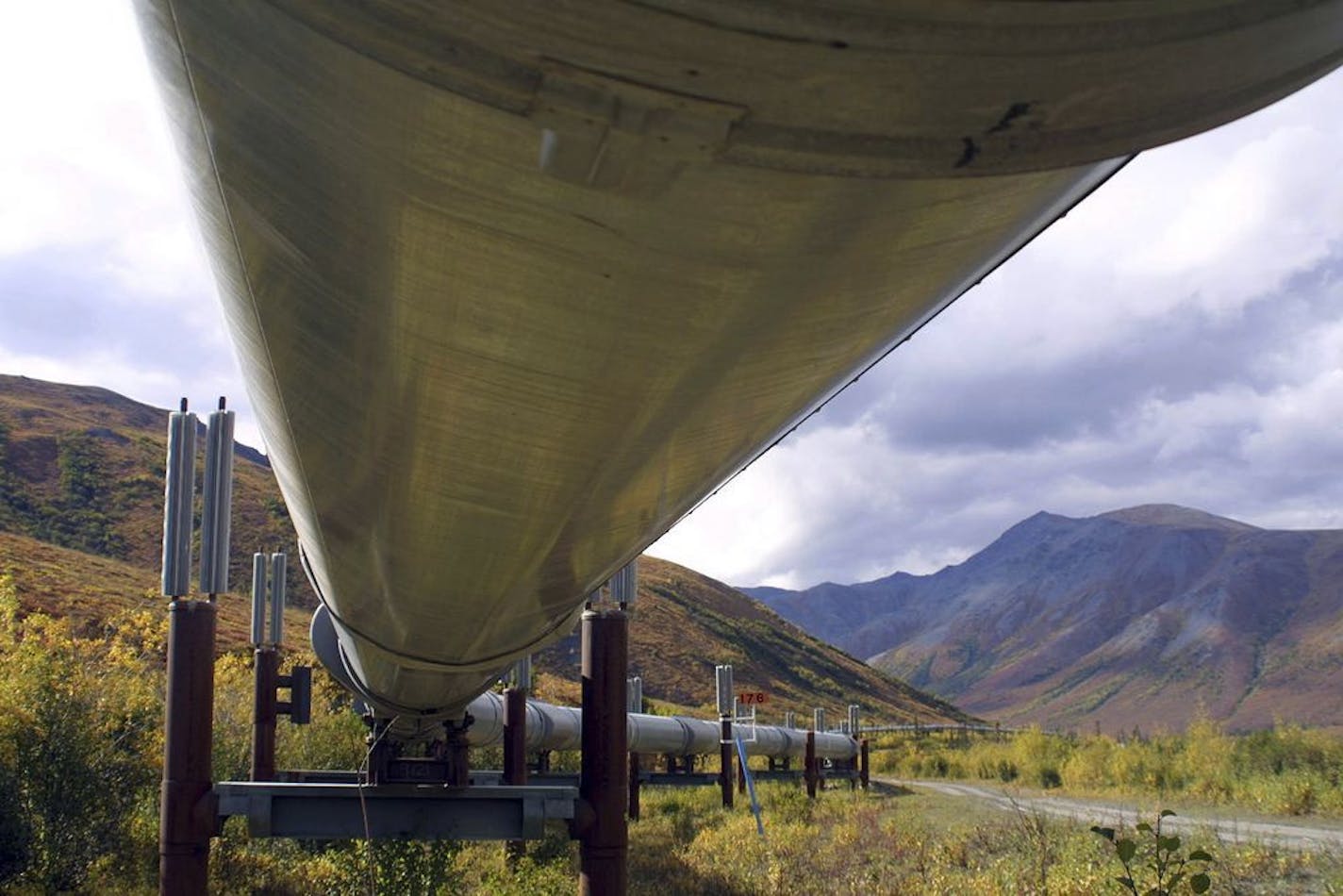 FILE - This undated file photo shows a portion of the 800-mile Trans-Alaska pipeline crossing the tundra north of Fairbanks, Alaska. For decades, Alaska has had an uneasy reliance on oil, building budgets around its volatile boom-or-bust nature. When times were rough, prices always seemed to rebound, forestalling a day of reckoning some believe may finally have come. The situation has politicians weighing changes to the annual dividend paid to residents from earnings of the state's oil-wealth fu