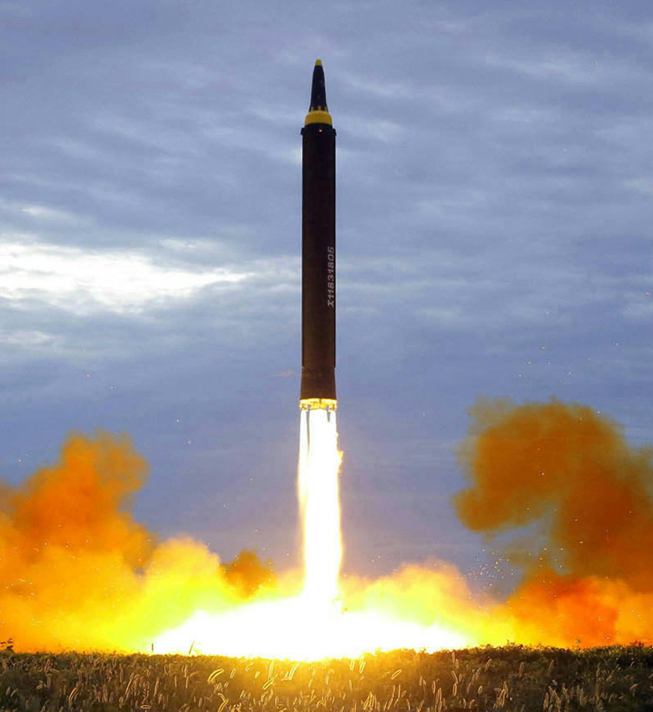 FILE - This Aug. 29, 2017, file photo by the North Korean government shows what was said to be the test launch of a Hwasong-12 intermediate-range missile in Pyongyang, North Korea. North Korea on Thursday, Dec. 20, 2018, says it will never unilaterally give up its nuclear weapons unless the United States removes its nuclear threat first. (Korean Central News Agency/Korea News Service via AP, File)