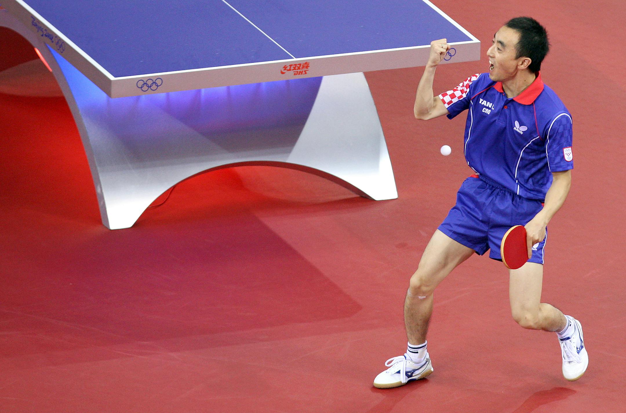 Croatia's Ruiwu Tan celebrated a point against Singapore during doubles table tennis matches on Thursday. Croatia beat Singapore in the match.